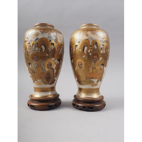 81 - A pair of Satsuma figure decorated oviform vases with signature marks to base, 7