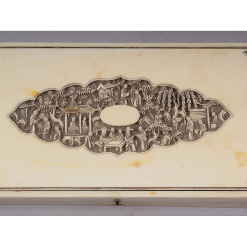 93 - A Cantonese carved ivory glove box with central panel, decorated figures and floral corners, 8 1/2