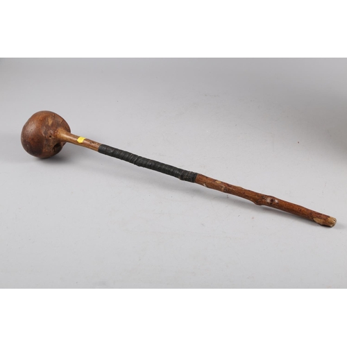 154 - A brass coopered oak jug/stick stand, a number of walking sticks and a shillelagh