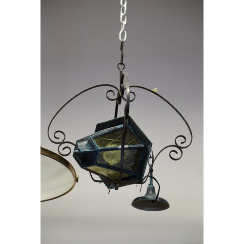 199 - A pair of wrought iron scrollwork table lamps, a scrollwork table lamp, a wrought iron lantern frame... 