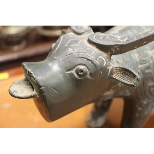 115 - A Chinese bronze limited edition ritual vessel, formed as a water buffalo with engraved archaic deco... 