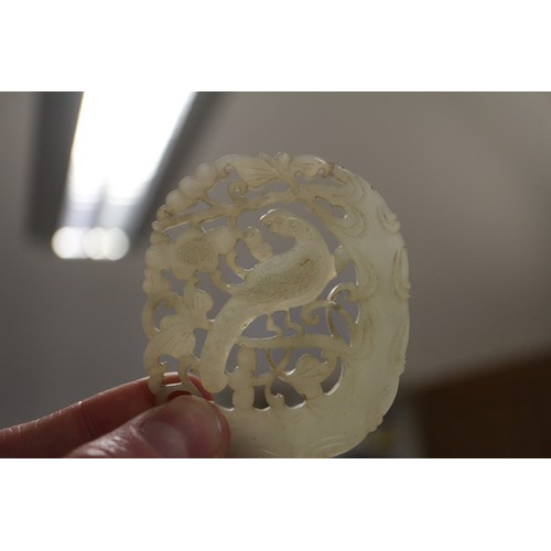 113 - A phoenix carved jade panel, 2 3/4