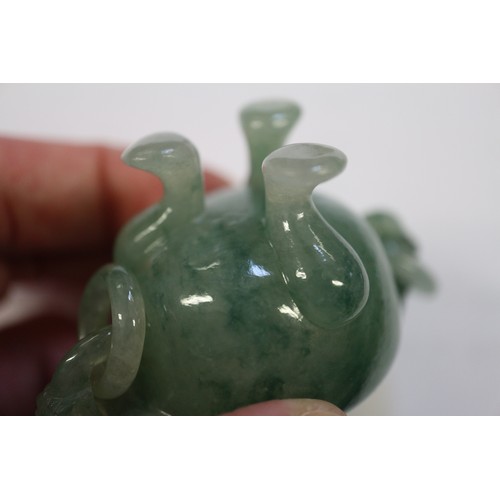 110 - A carved jade two-handled vessel, 4 1/8