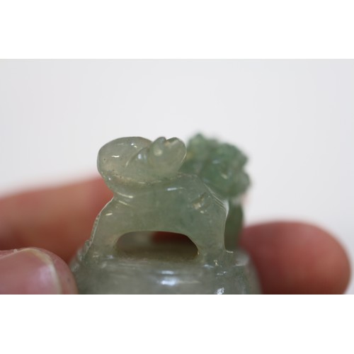 110 - A carved jade two-handled vessel, 4 1/8