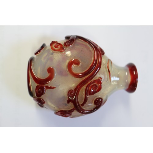 109 - A Chinese internal painted snuff bottle with coral stopper, 2 3/8