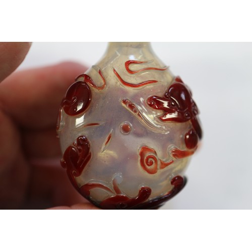 109 - A Chinese internal painted snuff bottle with coral stopper, 2 3/8