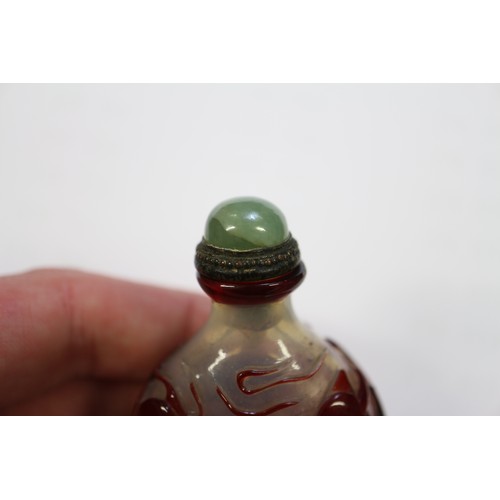 109 - A Chinese internal painted snuff bottle with coral stopper, 2 3/8