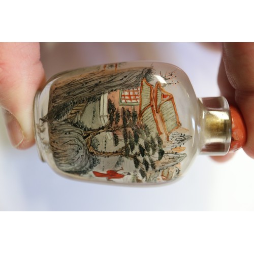 109 - A Chinese internal painted snuff bottle with coral stopper, 2 3/8