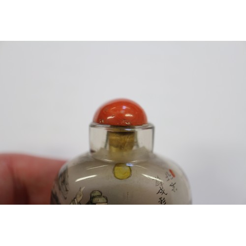 109 - A Chinese internal painted snuff bottle with coral stopper, 2 3/8