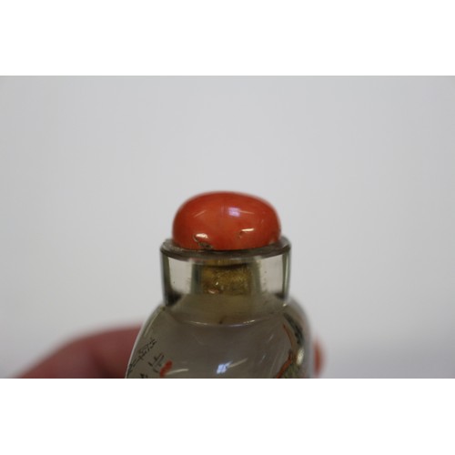 109 - A Chinese internal painted snuff bottle with coral stopper, 2 3/8