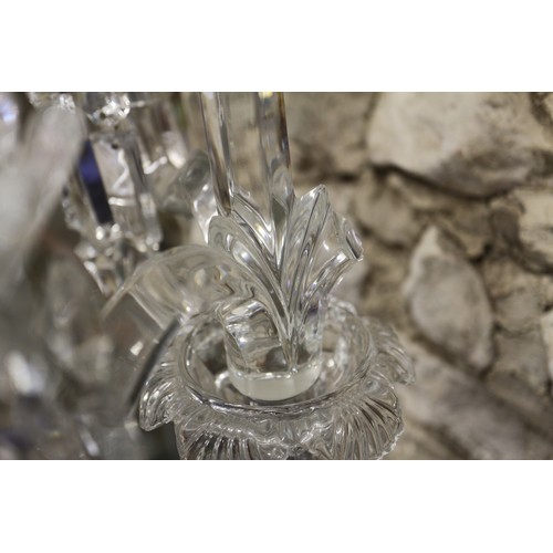 19 - A Baccarat three-light candelabra with frosted putto support, 21 1/2