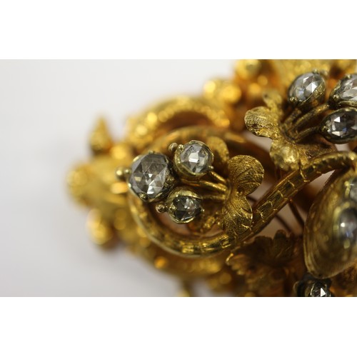 284 - A mid 19th century yellow metal scroll and leaf brooch set diamonds with two pendant drops, in conte... 