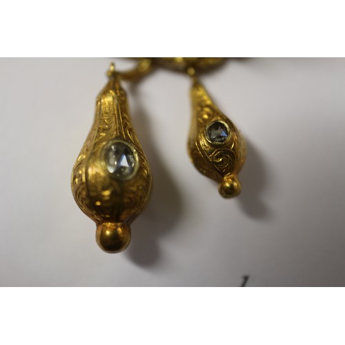 284 - A mid 19th century yellow metal scroll and leaf brooch set diamonds with two pendant drops, in conte... 