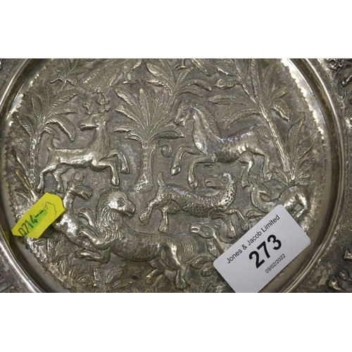 273 - A white metal dish, embossed animals, a white metal cup, a white metal beaker and five white metal a... 