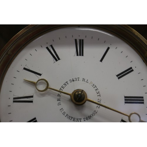 123 - A 19th century brass and four glass mantel clock with white enamel dial and Roman numerals, 10