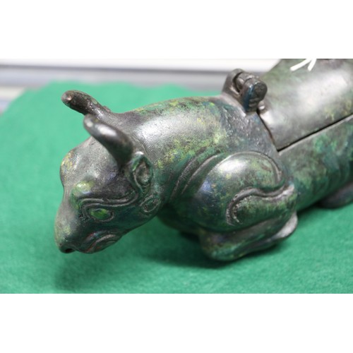 90 - A pair of Chinese bronze limited edition lamps, formed as recumbent cows, 26/50 and 35/50, 7 1/4