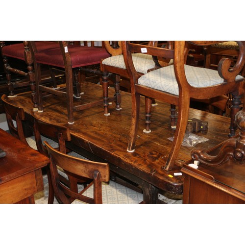 449 - An antique elm slab top refectory table, on chamfered and stretchered supports, top 84