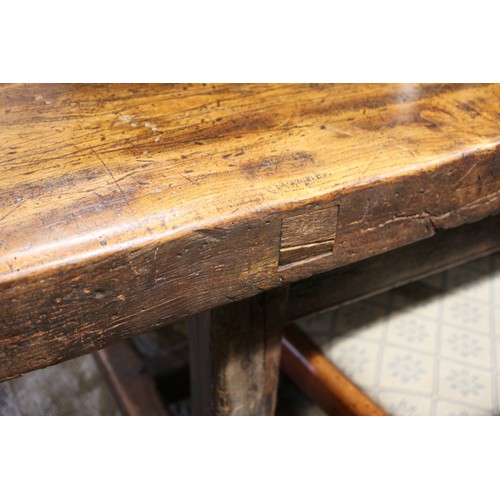 449 - An antique elm slab top refectory table, on chamfered and stretchered supports, top 84