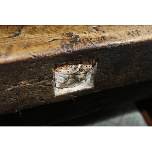 449 - An antique elm slab top refectory table, on chamfered and stretchered supports, top 84