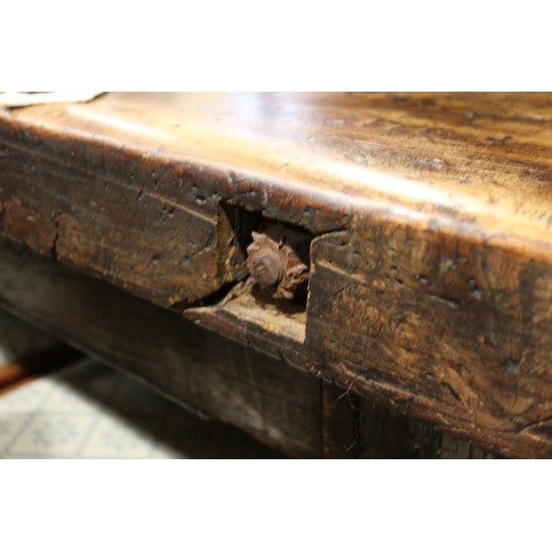 449 - An antique elm slab top refectory table, on chamfered and stretchered supports, top 84