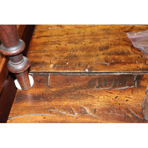 449 - An antique elm slab top refectory table, on chamfered and stretchered supports, top 84