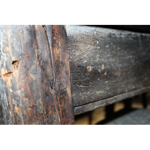 449 - An antique elm slab top refectory table, on chamfered and stretchered supports, top 84