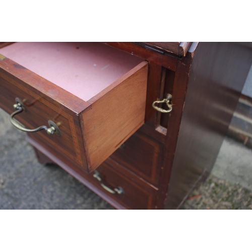 588 - An early 20th century walnut and satinwood banded fall front bureau with fitted interior over three ... 