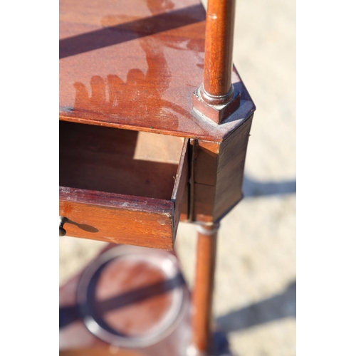 600 - A mahogany basin stand of Georgian design, fitted two drawers, on tripod splay support and pad feet,... 