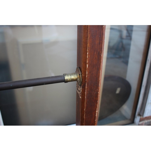 606 - An early 20th century grained as oak coat rack with extra brass rail, 64