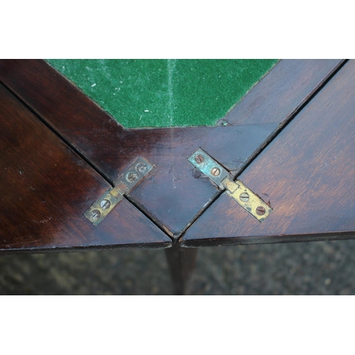 610 - A walnut and line inlaid envelope top card table, fitted one drawer, on square taper supports, 19