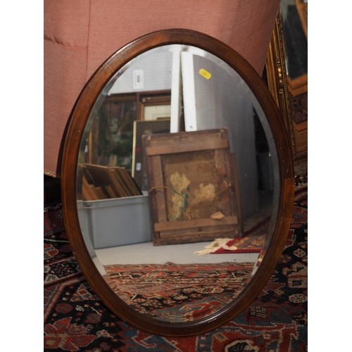 569 - A bevelled edge wall mirror, in gilt and silvered frame, plate 41 1/2