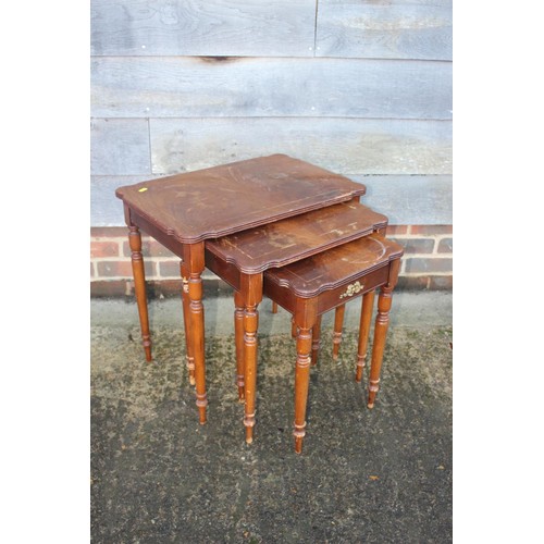 612 - A walnut line inlaid and brass mounted coffee table, on turned and fluted supports, 41