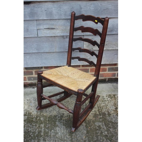 622 - A 1930s walnut framed shield-shape double bergere firescreen, 19