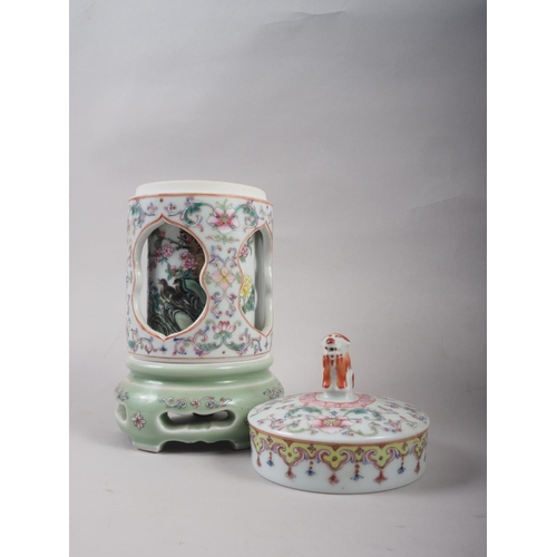 103 - A Chinese famille rose three-section reticulated and rotating pot and cover, decorated birds, with b... 