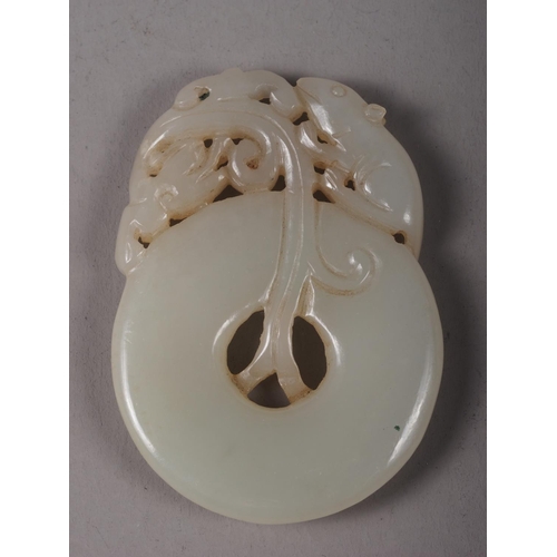 114 - A Chinese carved jade Pi disc with rat and dragon decoration, 2