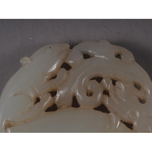 114 - A Chinese carved jade Pi disc with rat and dragon decoration, 2