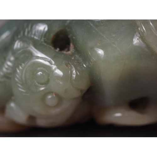 116 - A Chinese carved jade boulder with monkey and mythical beast, 4.6cm x 3.6cm approx