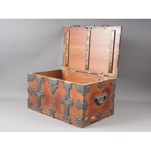 150 - A Hanseatic pine and brass bound strong box with scrollwork mounts and carry handles, 17