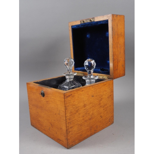 153 - A four-section oak cased decanter box, 8