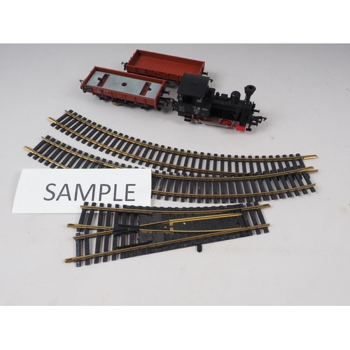 171 - A Fleischmann HO 040 gauge locomotive and a selection of track, in two boxes