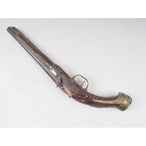 184 - A 19th century percussion cap pistol with carved walnut stock, 16