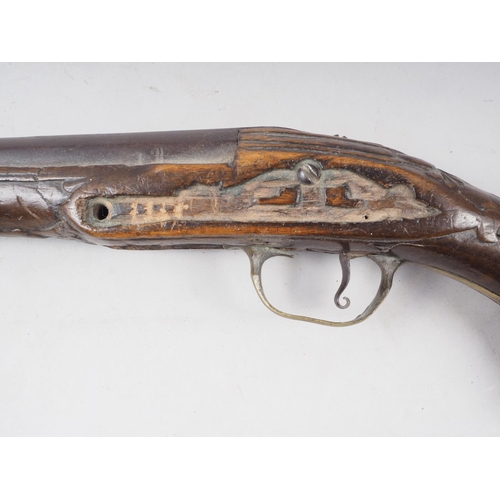 184 - A 19th century percussion cap pistol with carved walnut stock, 16