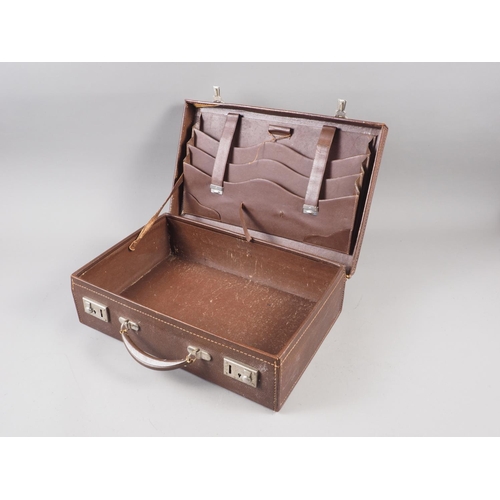 208 - A leather briefcase, a stoneware flagon, inscribed Holmes Harper and Neame Henley-on-Thames and Stro... 