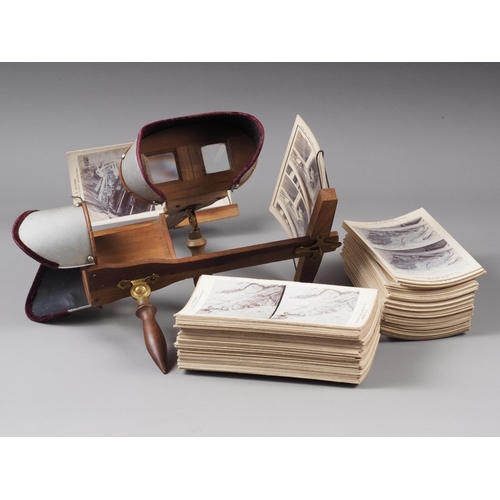 239 - A pair of engraved aluminium stereoscopic viewers and a collection of stereoscopic slides, South Afr... 