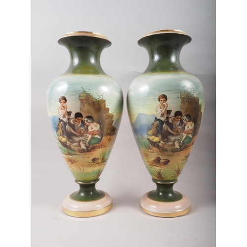 27 - A pair of late 19th century figure decorated oviform vases, 11