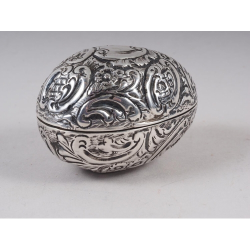 281 - A late 19th century chased and engraved silver egg with parcel gilt interior, marks Nathan and Hayes... 