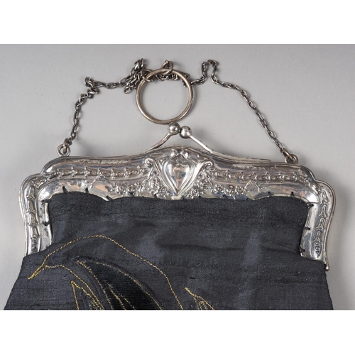 294 - A silk and sequin work evening bag with silver frame and chain