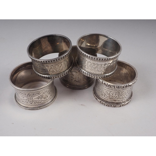 300 - A pair of silver napkin rings and three other silver napkin rings, 4.8oz troy approx