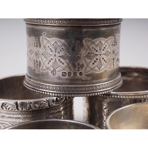 300 - A pair of silver napkin rings and three other silver napkin rings, 4.8oz troy approx