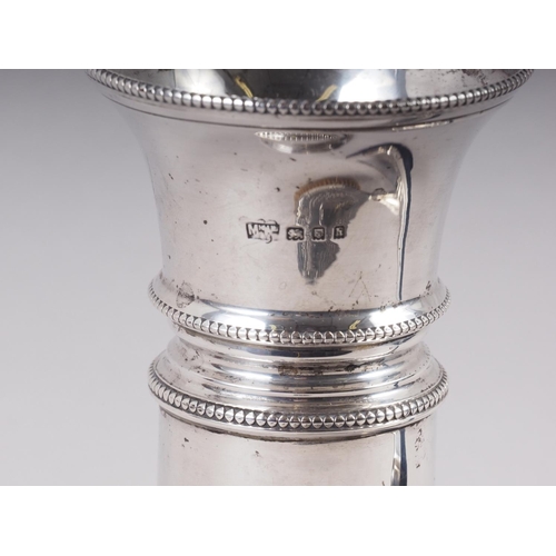 310 - An embossed silver backed hair brush, a Mappin & Webb silver bud vase, on weighted base, 6 1/2